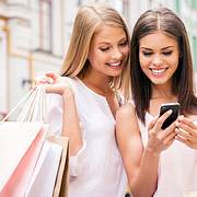 girls with smartphone transferring money